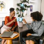 twowomenenjoyingjudescoffee Judes Rhyming Grind two women enjoying judes coffee